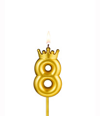 Golden number 8 birthday candle on white background