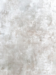 A close-up view of a light gray concrete surface with subtle variations in texture and tone