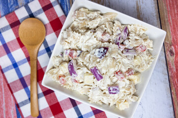 Celebrate 4th of July with a refreshing macaroni salad featuring pepperjack cheese and red onions...
