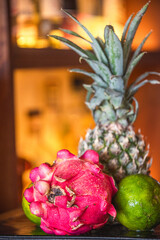 Tropical Fruit Arrangement with Pineapple, Dragon Fruit, and Limes