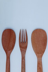 wooden cooking utensils on a white background