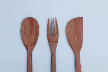 wooden cooking utensils on a white background