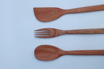wooden cooking utensils on a white background