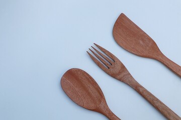 wooden cooking utensils on a white background