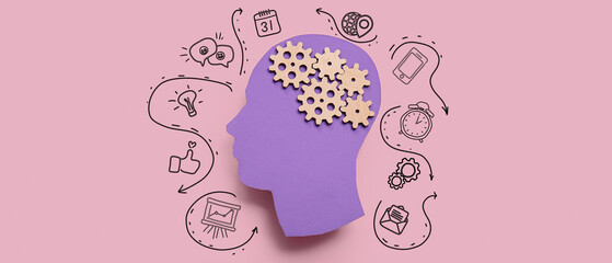 Paper human head with gears on pink background. Concept of brainwork