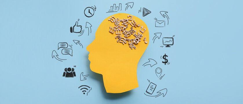 Paper human head with music notes on blue background. Concept of brainwork