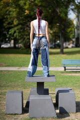 Rear view of woman with red braids and innovative patchwork style