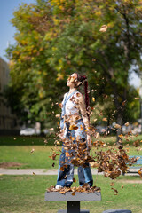 Young woman with braids capturing the spirit of autumn