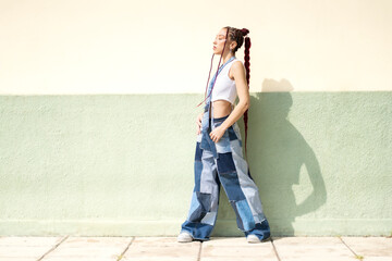 Fashionable woman showcasing unique denim and braids