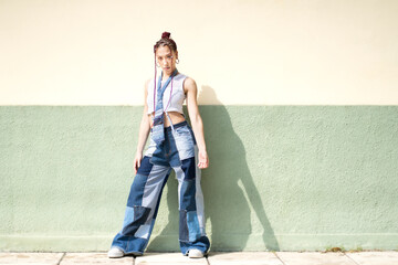 Woman with red braids and denim outfit in a city setting