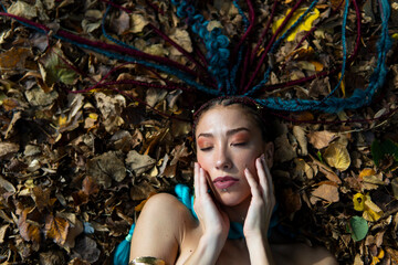 Artistic shot of a woman immersed in nature's autumnal palette