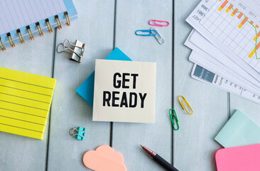 GET READY text on the cover of the notebook on the desk. Business concept