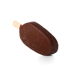 Delicious chocolate covered ice cream on stick against white background