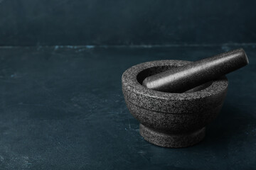 Mortar and pestle on dark background
