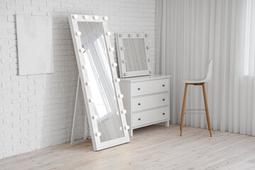 Interior of dressing room with mirrors and drawers