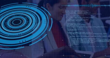 IT professionals in suits interacting in office with tablet, holographic HUD, code panels