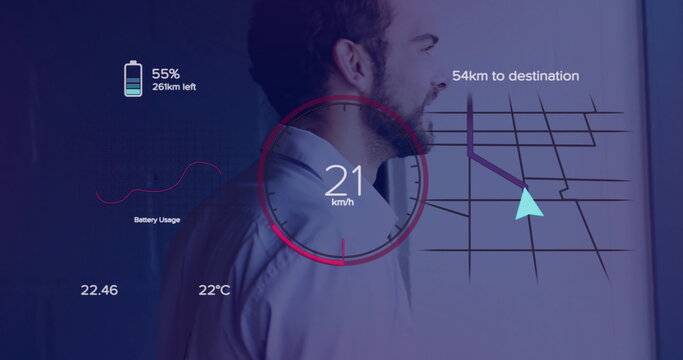 Standing bearded man wearing shirt checking projected battery, speedometer and map in meeting room - Powered by Adobe