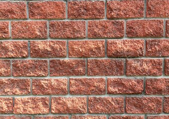 sturdy red brick wall features variety textures while showcasing uniform rows bricks in residential...