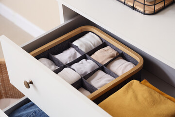 Open drawers with clean clothes, closeup