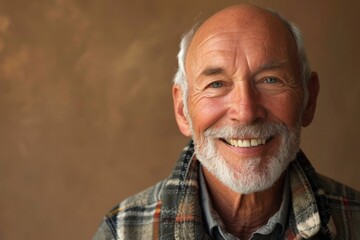 Portrait of a smiling senior man with white beard and mustache.