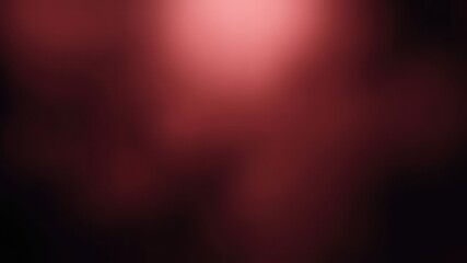 Abstract reddish maroon gradient background with soft light and dark shadows creates a sense of depth