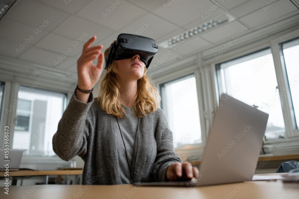 Poster office worker interacting with virtual reality headset and using laptop, exploring immersive technol