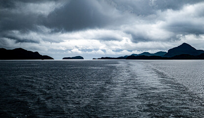 Milford sound fiordland new zealand national park beautiful landscape nature fiords low cloud fog...