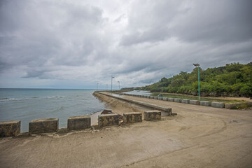 Pier Jetty on cloudy sky, cemented Boardwalk