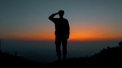 Silhouette of a person saluting at sunrise.