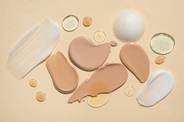 Composition with different samples of cosmetic products on color background