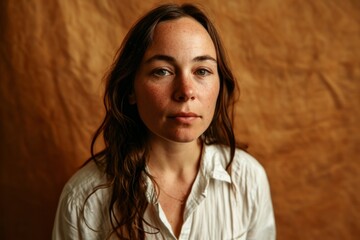 Portrait of a young woman with freckles on her face
