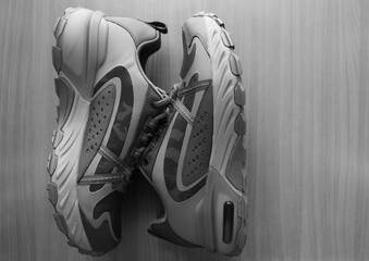 sports TRAVEL shoes with modern lace design for men or unisex, isolated on wooden background....