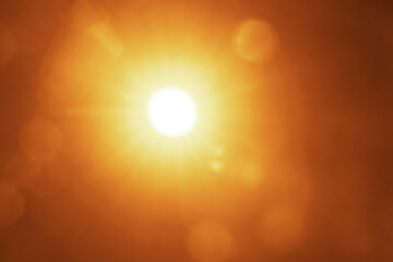 yellow golden orange sun rays of light. bokeh blurred background. Sunny backdrop, sun with lens flare on sky, Shining sun. clear sky. Solar copy space. Natural Sunrays of bright sun on summer day