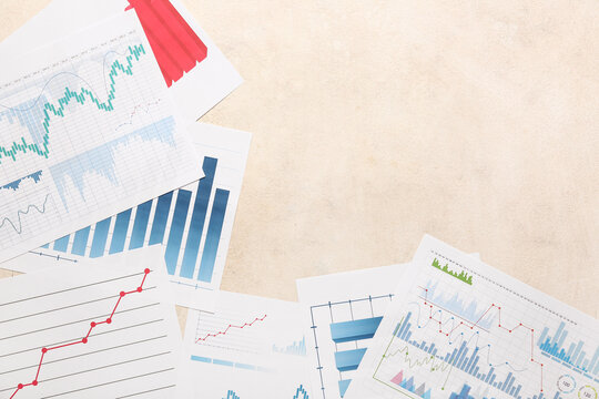 Many business documents with graphics and diagrams on white background - Powered by Adobe