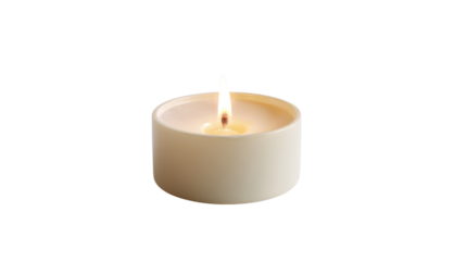 Close up of a lit tea light candle with a warm flame isolated on transparent background