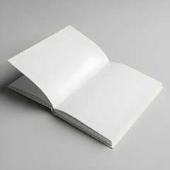 Open blank book with white pages on a gray surface for design.