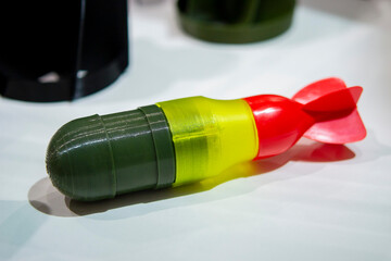 Bomb. Bomb model for drone. Model of bomb printed on 3D printer from melted plastic. Body of bomb with tail created on 3D printer. Prototype of ammunition printed on 3D printer. Innovation 3d printing