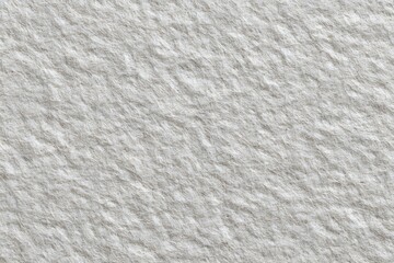 Obraz premium Close-up of textured, weathered surface with a rugged, stone-like appearance. The rough texture has a strong pattern, and the surface is evenly lit