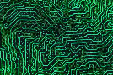 Close-up of an intricate circuit board with glowing green pathways