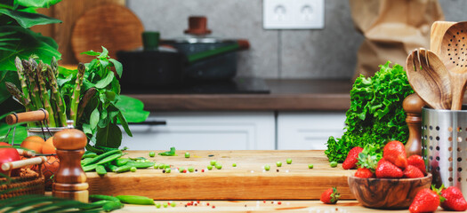 Vibrant kitchen setup with fresh vegetables and utensils for healthy vegan cooking