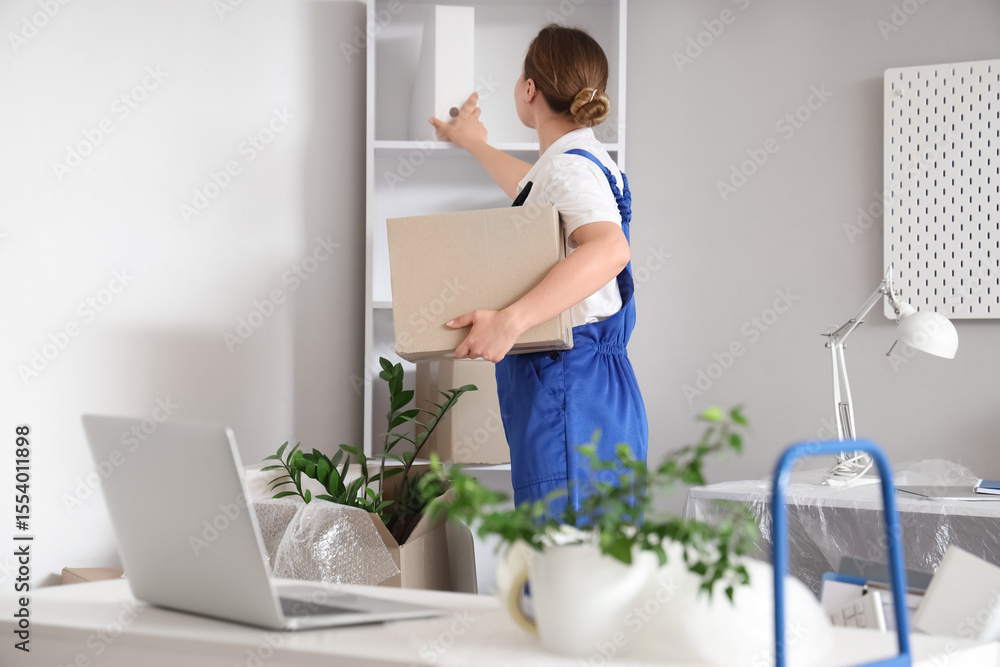 Poster female worker with box and folder from shelf in office on moving day, back view
