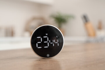 Modern kitchen timer on table in room, closeup