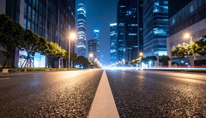 Low angle view of an illuminated urban street with modern buildings at night with light trails.