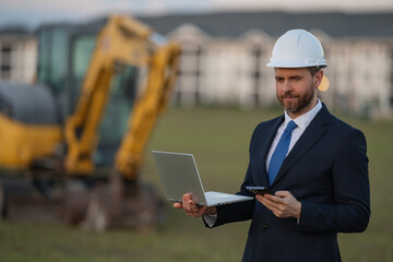 Worker in suit and helmet. Investor civil engineer, construction manager. Construction building...