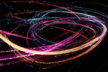 Abstract light trails on black background, colorful glowing streaks, modern art design