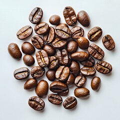 Aromatic dark coffee beans scattered on a light background.