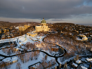 Fototapeta premium Aerial view of St. Josephs Oratory of Mount Royal at Sunset in winter. Montreal, Quebec, Canada.