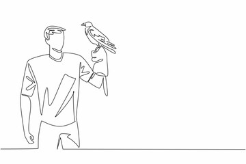 Single one line drawing hooded crow perched on hand of man. Weekend at the zoo. Trying to take pictures with the birds. The bird lover. Man Holding Bird. Continuous line design graphic illustration