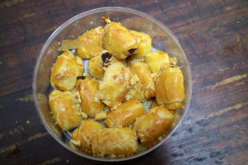 Golden Brown Pastry Rolls in Container