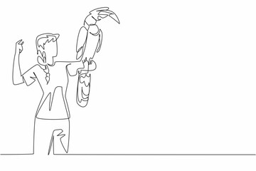 Continuous one line drawing the great hornbill bird perched on hand of woman. The crested has a large yellow beak. Big colorful bird. Woman Holding Bird. Single line draw design vector illustration